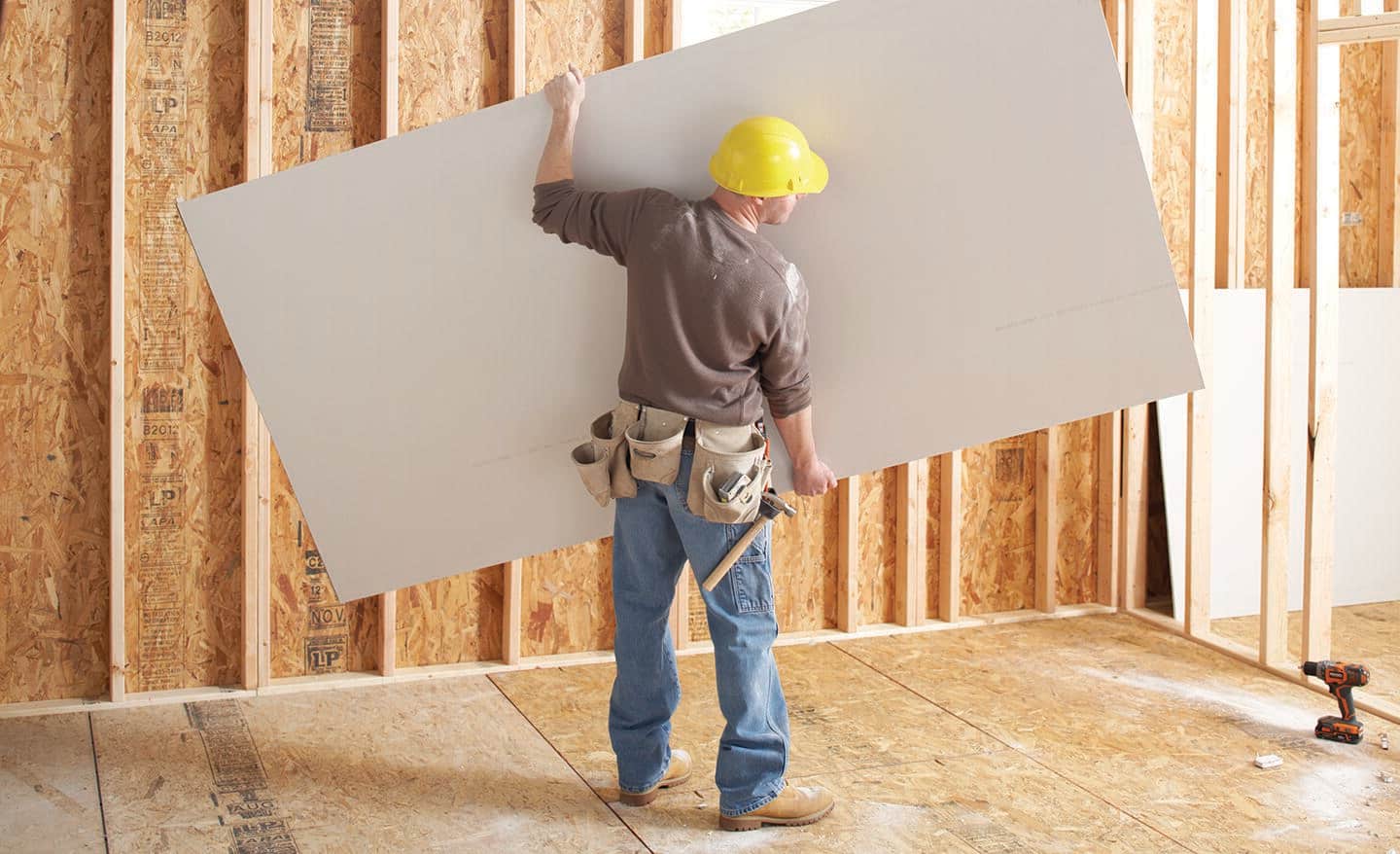 Drywall installation in progress in a Tulsa-area home remodel